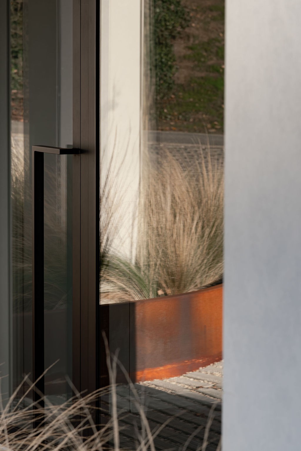 trekker inkomdeur met reflectie